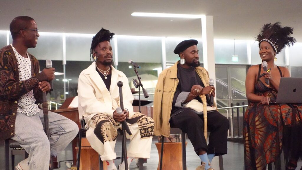 Four people performing music.