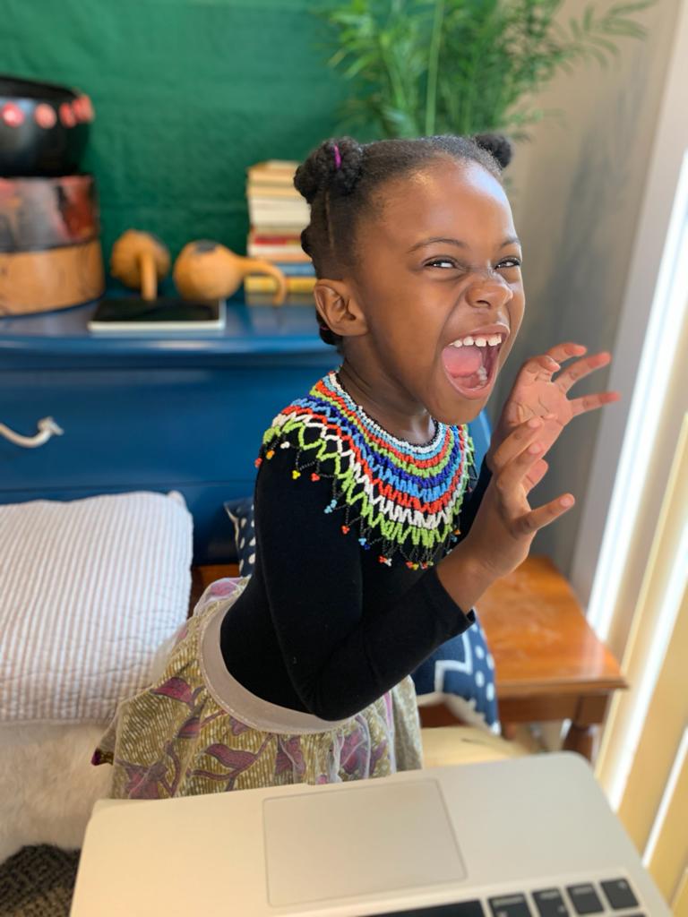 A little girl posing for a photo.