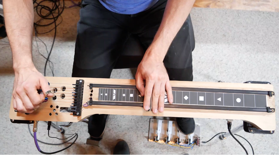 Musician playing the Electrosteel instrument