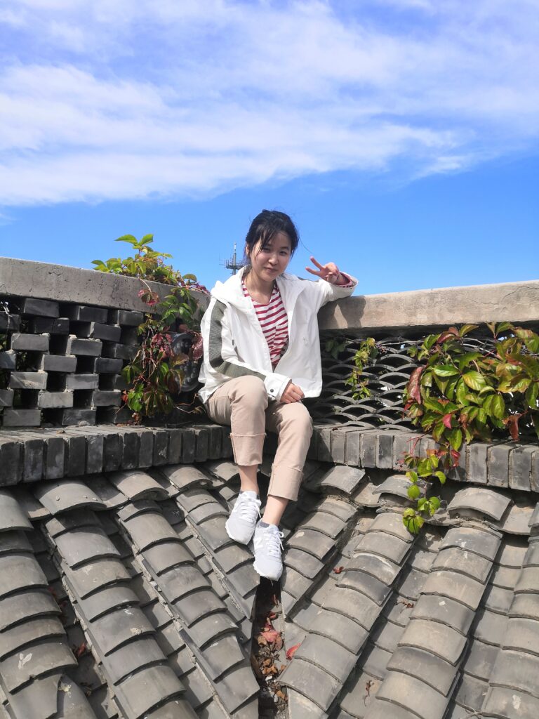 A person sitting on top of a roof