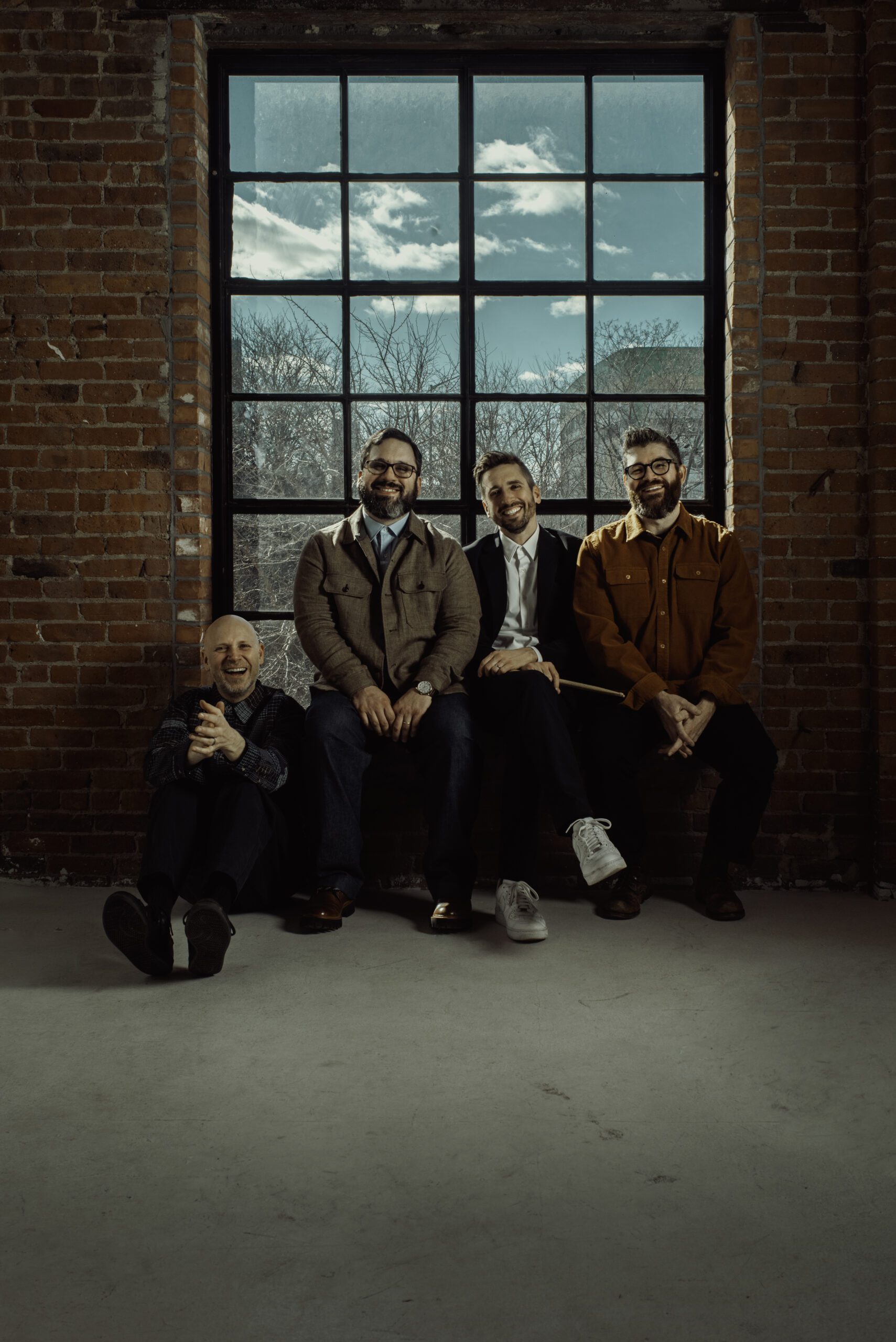 A group of people sitting by a window