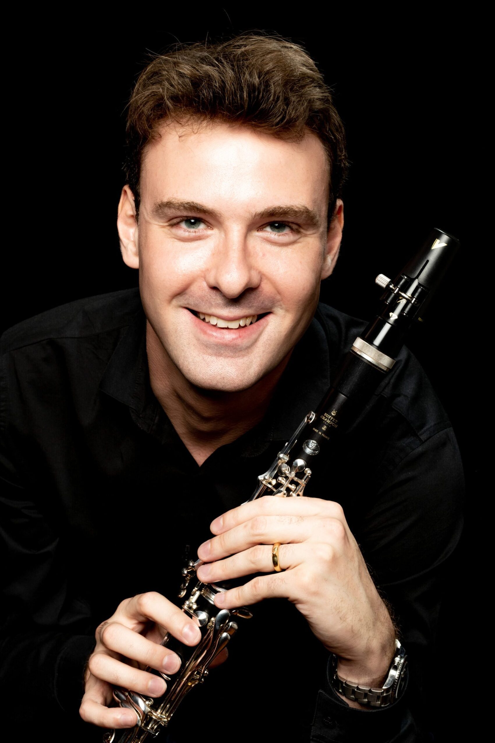 A person holding a clarinet