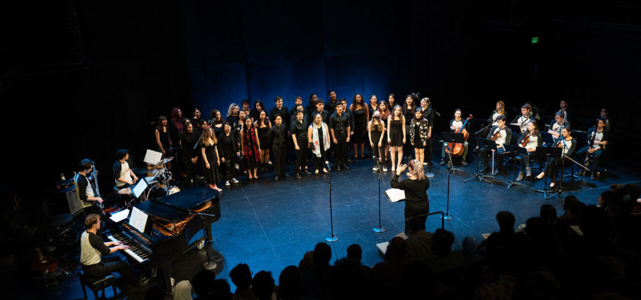 A group of musicians performing on stage