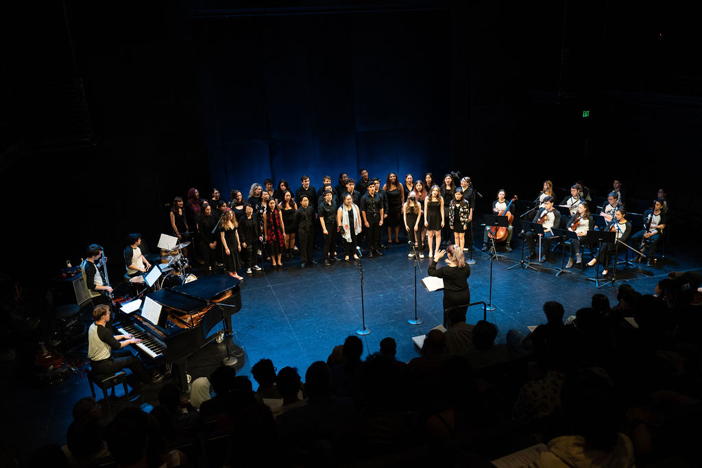 A group of musicians performing on stage